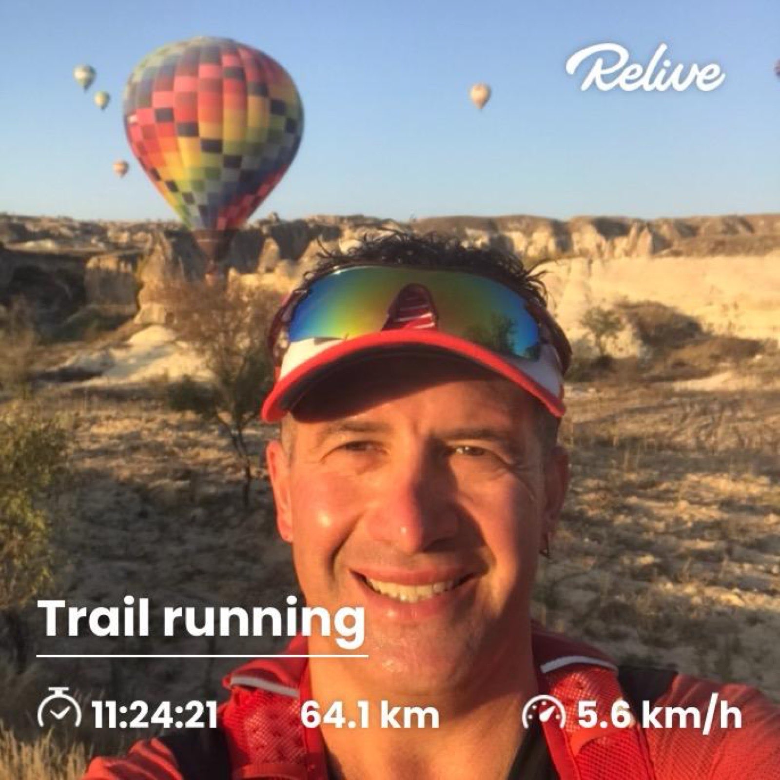 Erden Giritli in Cappadocia with hot air balloons, reflecting his trail running experience