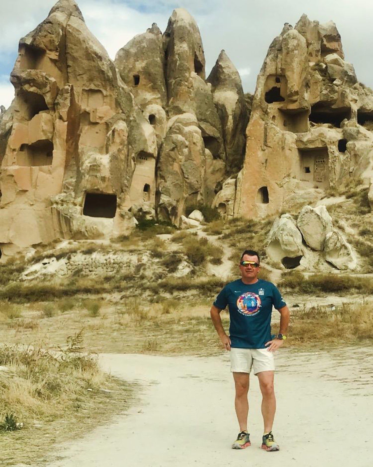 Erden Giritli in front of Cappadocia rock formations, reflecting his trail running coach experience