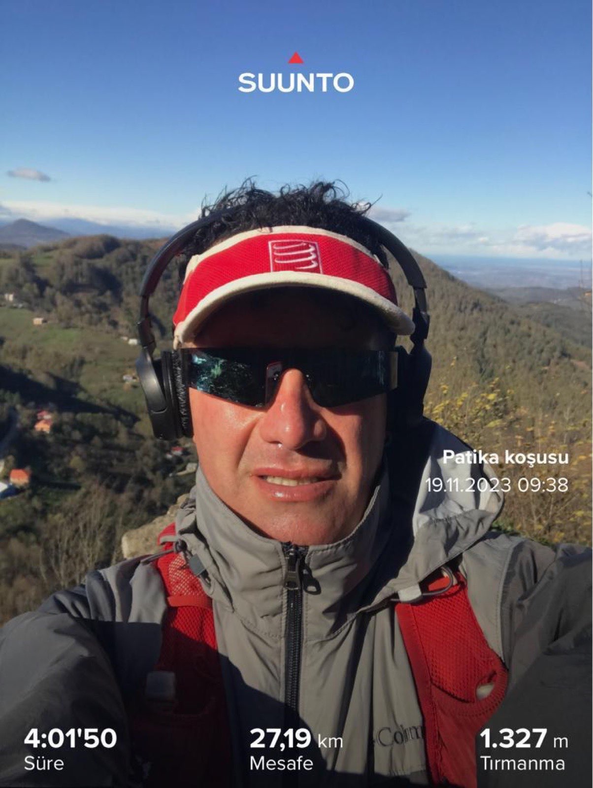 Erden Giritli taking a selfie on a mountain trail, showing his endurance coach and running coach experience