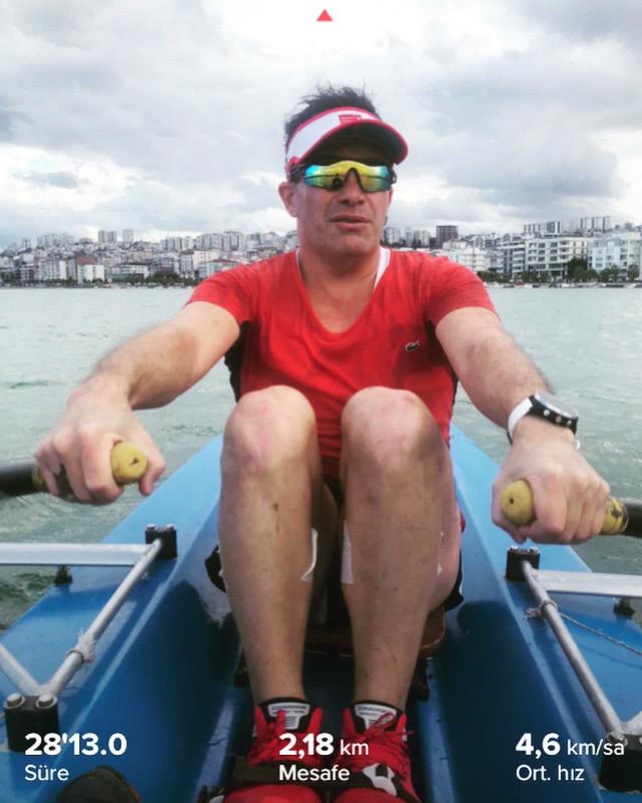 Erden Giritli during a sea rowing workout, reflecting his endurance coach and conditioning-focused approach